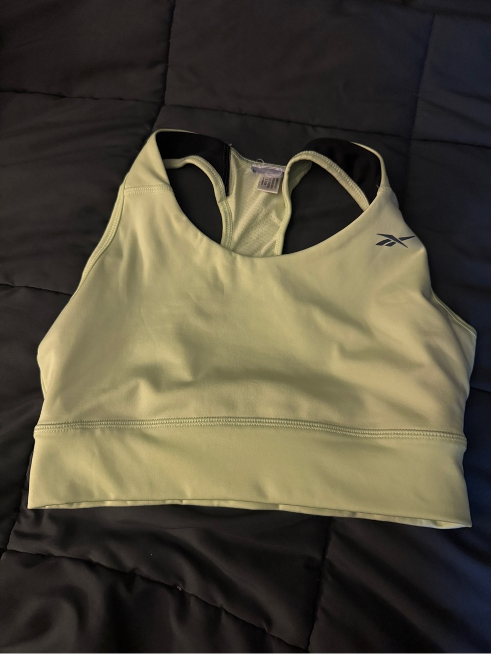 Gently used Reebok light green sports bras